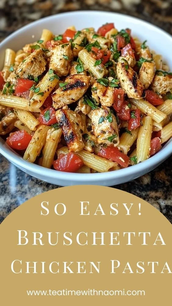 Bruschetta-Style Chicken Pasta with tomatoes and basil in a bowl