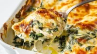 Cream Cheese Chicken and Spinach Casserole served in a baking dish.