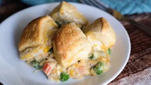 Creamy chicken pot pie topped with flaky biscuits, ideal for a comforting meal