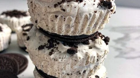 No-bake Oreo cheesecake bites with crushed Oreos and cream cheese topping