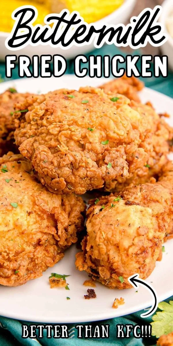 Plate of crispy buttermilk fried chicken with herbs and sides