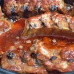 Delicious crock-pot barbecue ribs served with side dishes