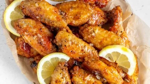 Delicious Honey Lemon Pepper Wings served with fresh garnishes