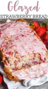 Strawberry-glazed bread showcasing a vibrant glaze and fresh strawberries on top.