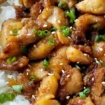 Delicious garlic ginger chicken served with rice and vegetables
