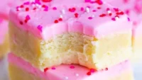 Delicious and soft ultimate sugar cookie bars on a plate