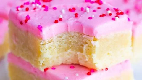 Delicious and soft ultimate sugar cookie bars on a plate