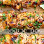 Zesty honey-lime chicken dish garnished with fresh herbs