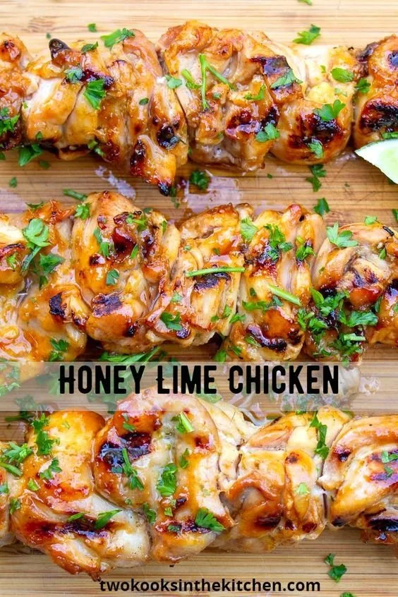 Zesty honey-lime chicken dish garnished with fresh herbs
